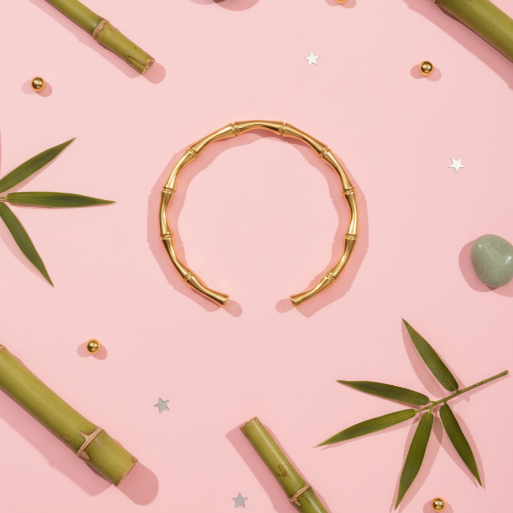 Gold bracelet on a pink background