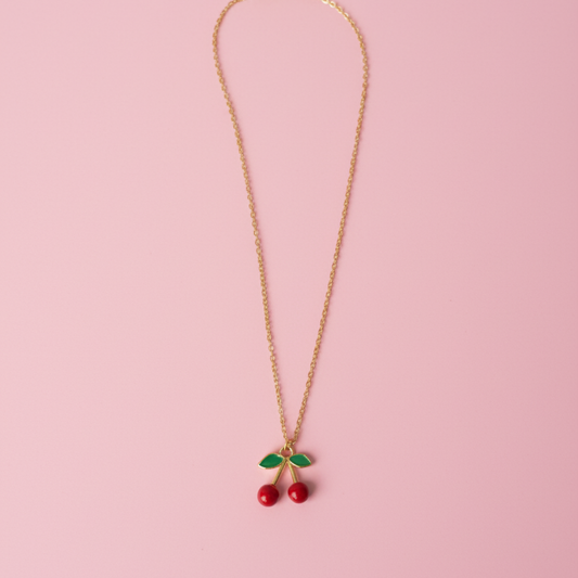 Necklace with cherry pendants on a pink background